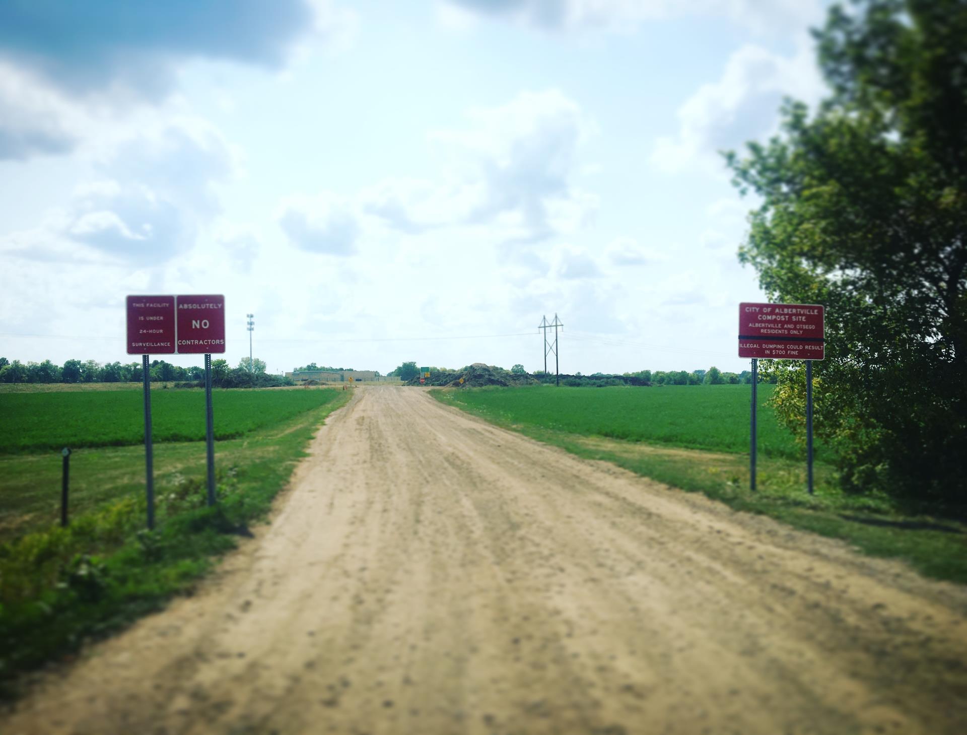 Compost pic (dirt road & signs)